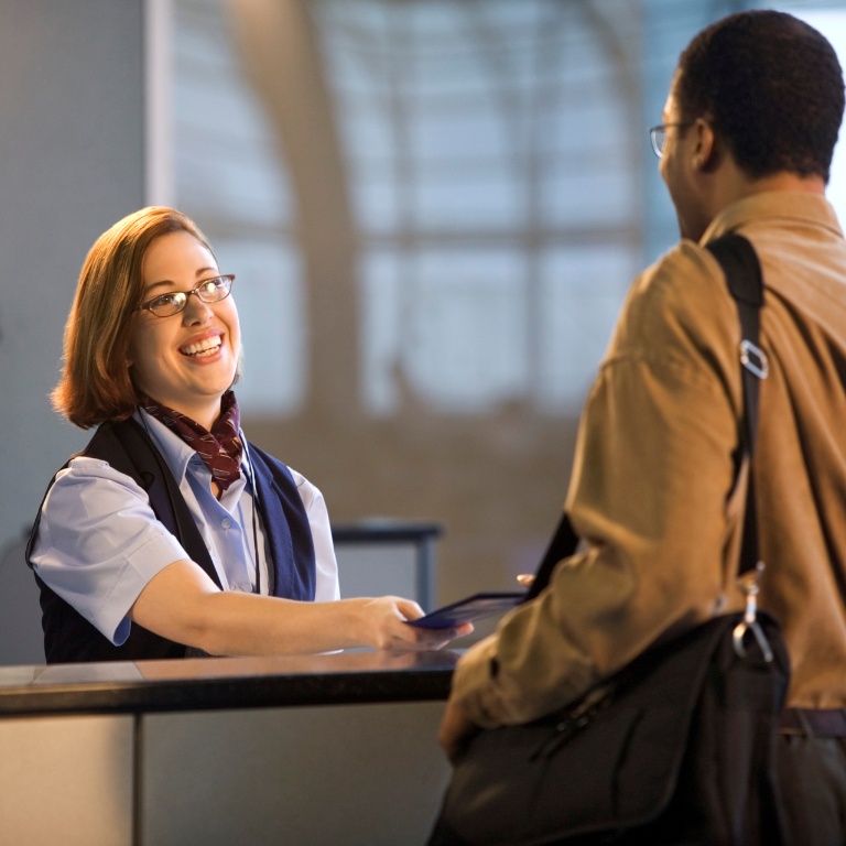 Customer service representative helping with flight booking